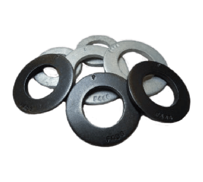 A group of flat, circular metal washers with central holes, arranged in a slightly overlapping manner on a plain background.