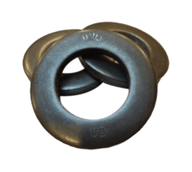 Three black metal washers are stacked and overlapping each other against a plain background.
