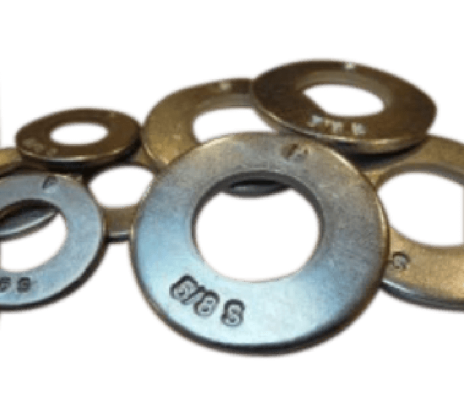 A group of metal washers of varying sizes stacked partially overlapping each other on a plain background.